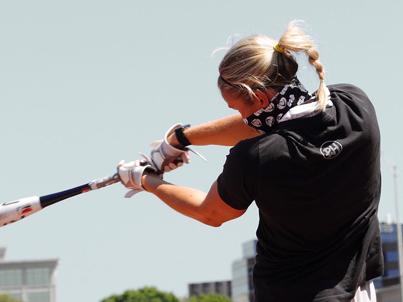Victoria Hayward swings the bat.