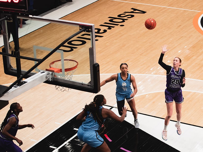 Aerial photo of Kirby Burkholder shooting towards the net of an Athletes Unlimited Women's Professional Basketball Game