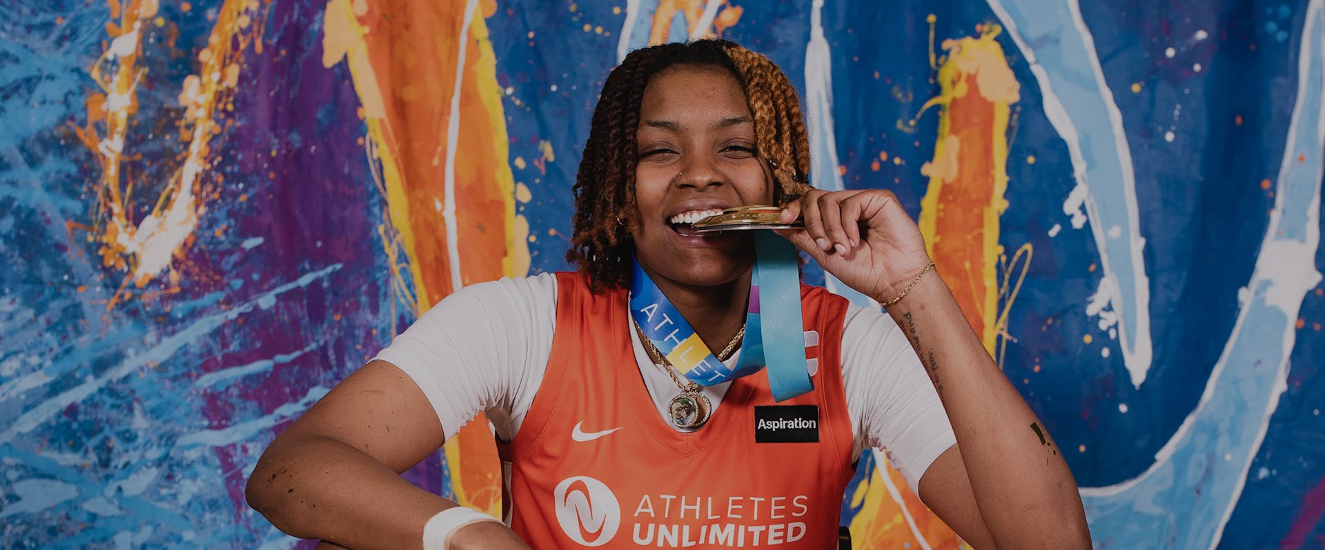 NaLyssa Smith bites down on her Championship medal.