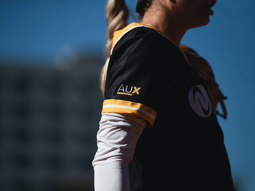 Gold term jersey with the AUX logo.