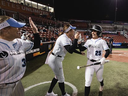 Megan Wiggins celebrates with teammates.