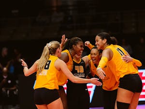 Volleyball team celebrates on the court