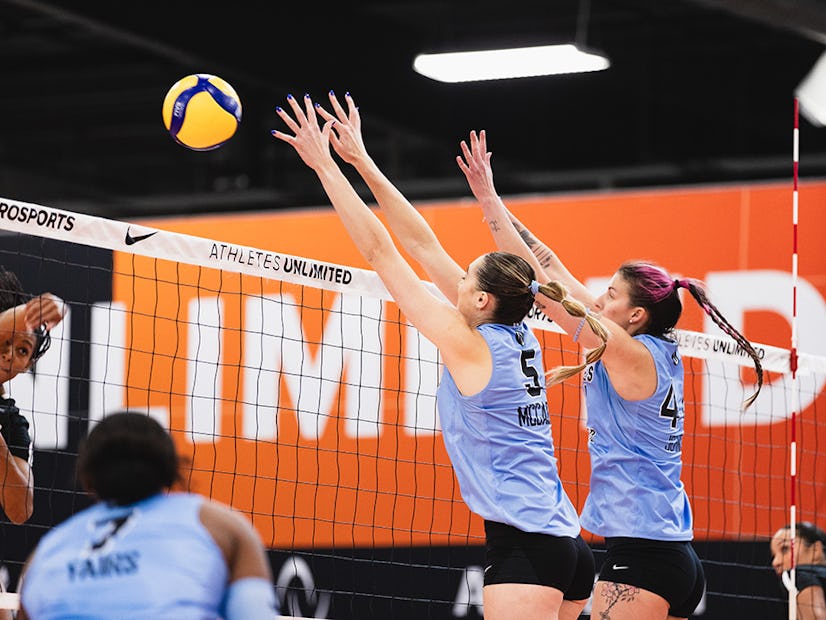 Molly McCage, Willow Johnson jump for a block