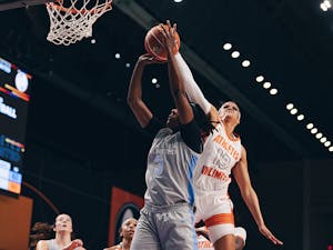 Rae Burrell blocks a shot