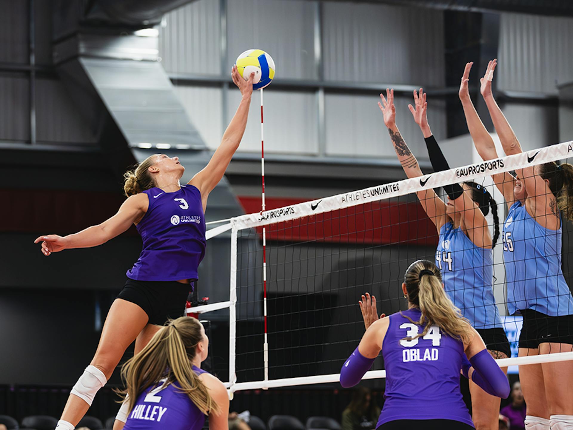 Brooke Nuneviller tips the ball over the net